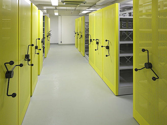 Mobile archive shelving with crank drive and yellow perforated end panels